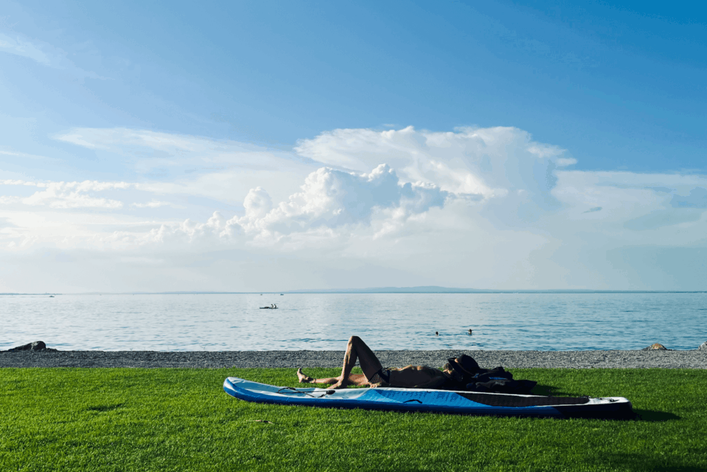 A man is enjoying his life after a surfing session just chilling out, this is what life is all about