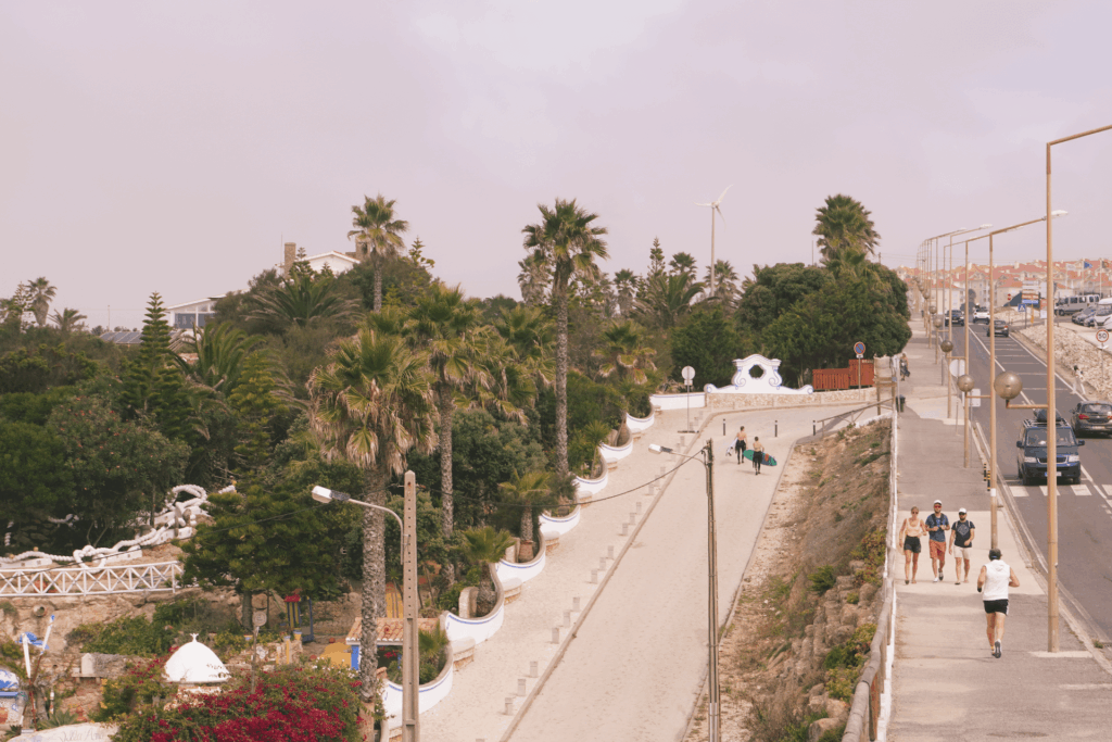 A typical day in a surf town, with joggers, commuters and surfers after a session